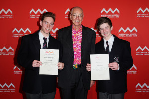 SYDNEY, AUSTRALIA - AUGUST 26:  Dr Karl Kruszeinicki (c) presents Harry Bebbington and Tom Downie with second prize in the 'University of Sydney Sleek Geeks Science Eureka Prize - Secondary' at the Australian Museum Eureka Prizes 2015 at Sydney Town Hall on August 26, 2015 in Sydney, Australia.  (Photo by Brendon Thorne/Getty Images)