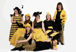 6 women in yellow and black costumes