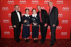 SYDNEY, AUSTRALIA - AUGUST 26: Trevor Hambley, Adam Spencer and Dr Karl Kruszelnicki present Ella Woods and Georgia Souyave-Murphy of St Margaret's Anglican Girls School Brisbane with first place in the 'University of Sydney Sleek Geeks Science Eureka Prize - Primary' at the Australian Museum Eureka Prizes 2015 at Sydney Town Hall on August 26, 2015 in Sydney, Australia. (Photo by Brendon Thorne/Getty Images)