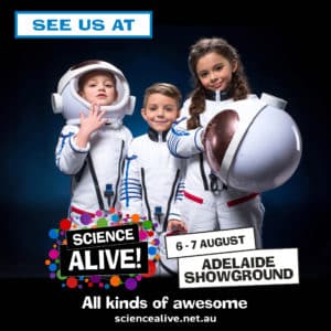 Three children dressed as astronauts